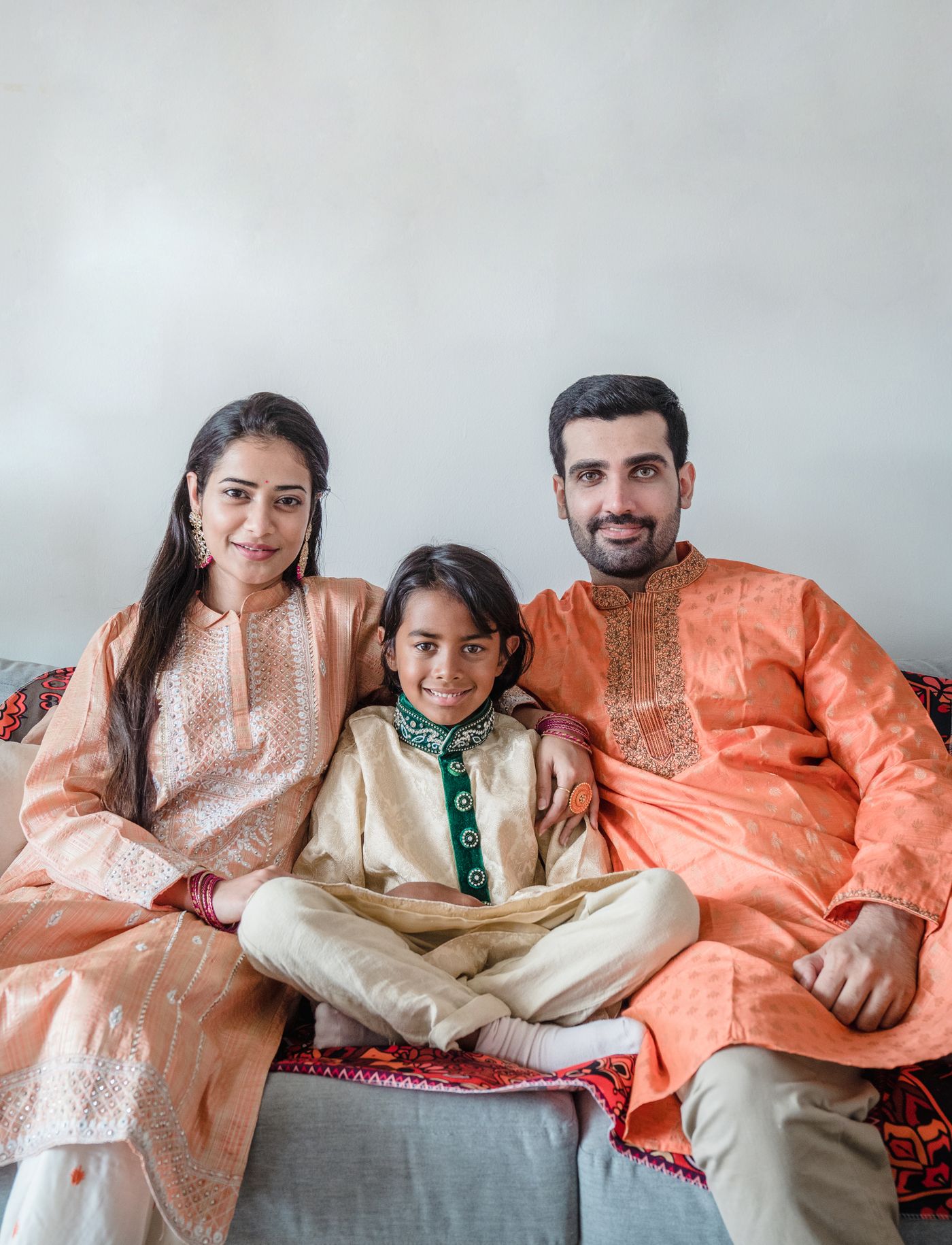 An Indian family relaxing together at home
